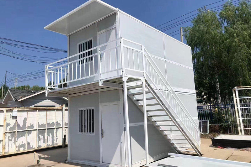 Folding two-story mobile home